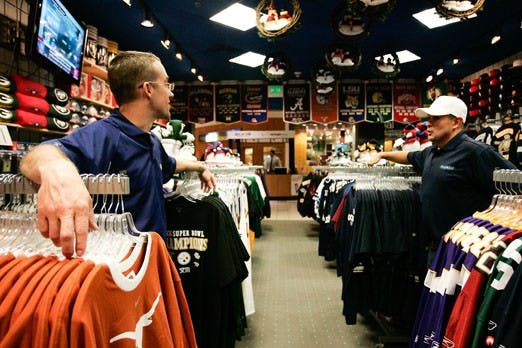 Pro Image co-owners Chris Byrd, left, and Steve Horton talk Tuesday at their store in Cottonwood Mall. 