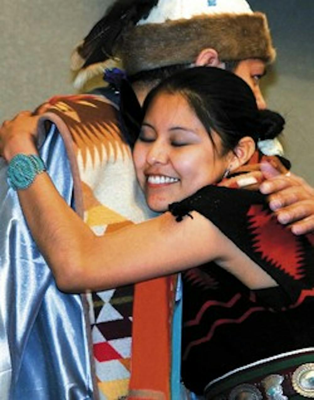 UNM Kiva Club's Vice President Leona Morgan hugs President Patrick Willink at the Native American Studies convocation May 12 in the SUB.