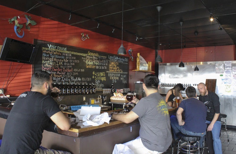 People gather at Marble Brewery on Feb. 25th to enjoy drinks and interact with fellow bar-goers. Lizard Tail Brewing received the Small Brewing Company of the Year award at the 2014 Great American Beer Festival. 