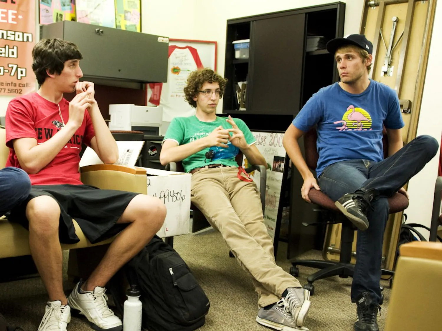 Bryan Jurus (far right), director of Student Special Events, talks with students in the SSE office downstairs in the SUB about ideas they have for upcoming events on campus. In the photo from left to right are students Jeff Gallegos and Alex Borowski.