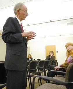 Patrick Maney, a candidate for dean of the College of Arts and Sciences, answers a question from biology professor Mary Anne Nelson during a faculty question-and-answer session Monday in the SUB. 