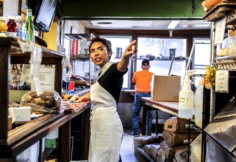 Golden Crown Panaderia employee, Alex Williams, talks with customers on Sept. 20, 2017 at Albuquerque’s local Golden Crown Panaderia. The panaderia made more than 500 loaves of bread and drove it out to Houston in ten trucks.