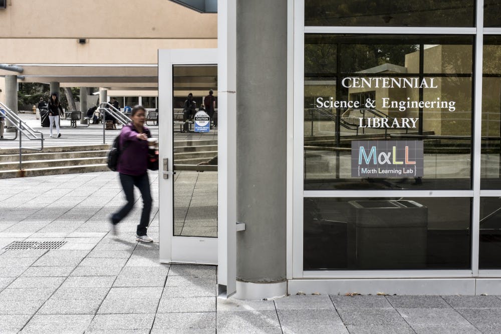 Student enters Centennial Library.
