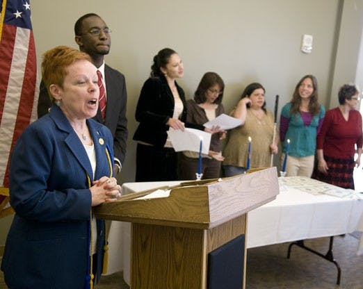 Edith Miller, left, speaks at the SUB on Friday during the first initiation ceremony of Delta Alpha Pi, an honor society for students with disabilities. Miller co-founded the group, which started in Pennsylvania five years ago. It now has 32 chapters in 1