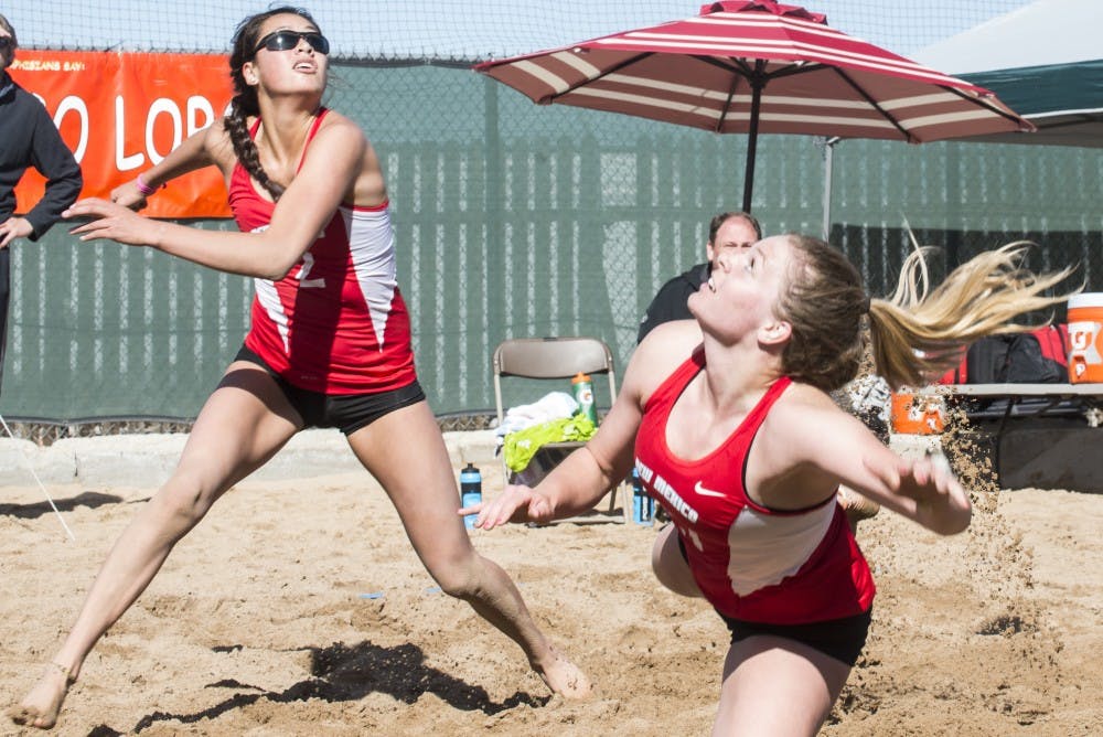Sophomore Eastyn Baleto (left) and junior Julia Warren look up for a high ball during a spring 2015 game. The Lobos will play Grand Canyon University and San Jose State this upcoming Sunday in Phoenix, Arizona.