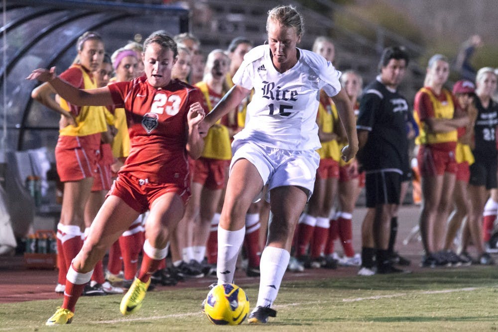 New Mexico midfielder Alyssa Coonrod attempts to regain possession of the ball against a Rice opponent last September. The Lobos host Loyola-Chicago in its home opener tonight, the first home game since a hazing incident that occurred on Aug. 17.