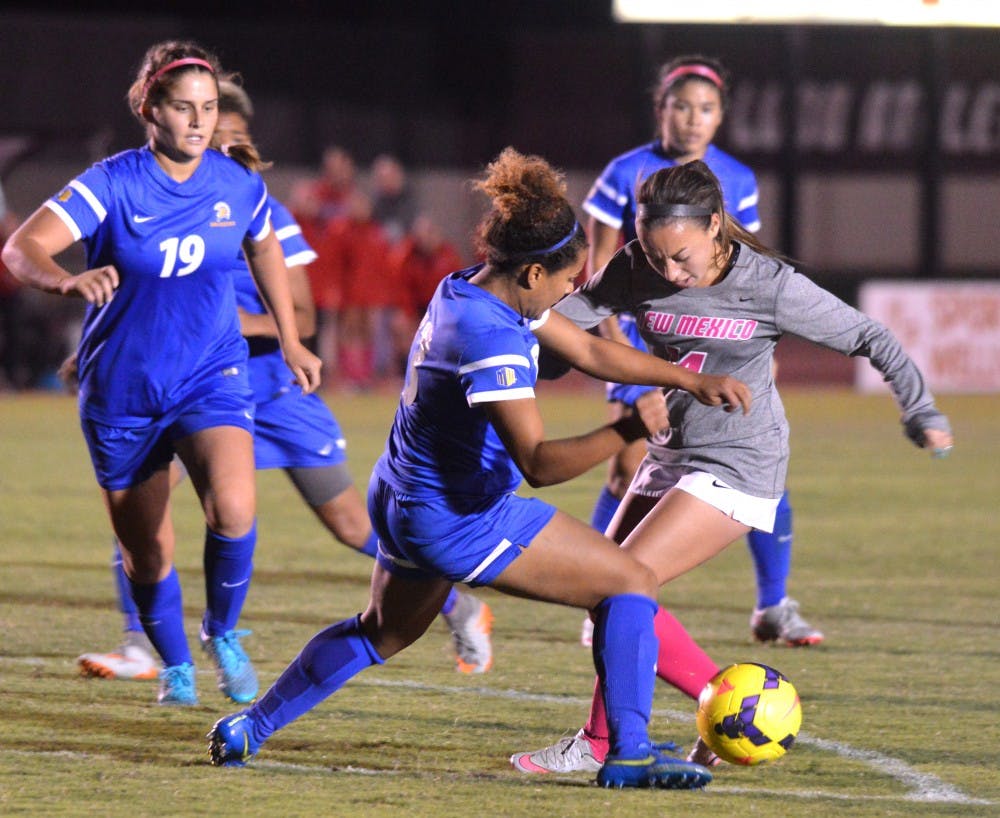 Sophmore midfielder Claire Lynch becomes surrounded by San Jose players Oct. 16 at the UNM Soccer Complex. The Lobos lost in overtime to San Jose 1-2. 