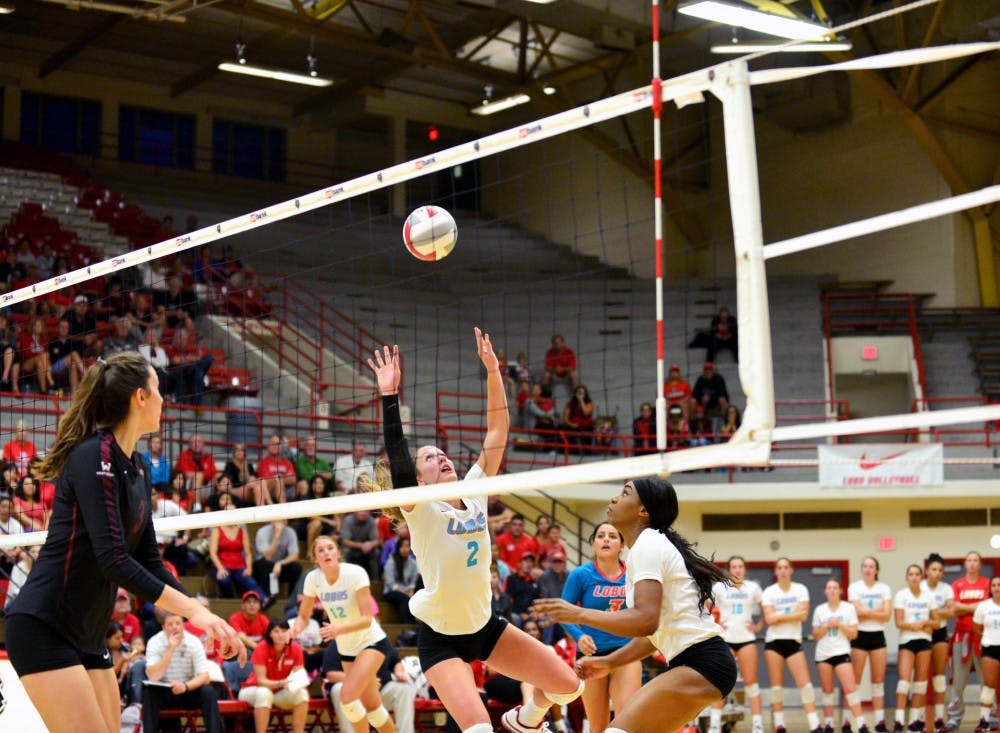 Hannah Johnson sets up Simone Henderson for a kill against Santa Clara Friday night. The first of three games in the Lobo Classic was in the Lobos favor, beating the Broncos 3-0 for head coach Jeff Nelson’s 400th win.