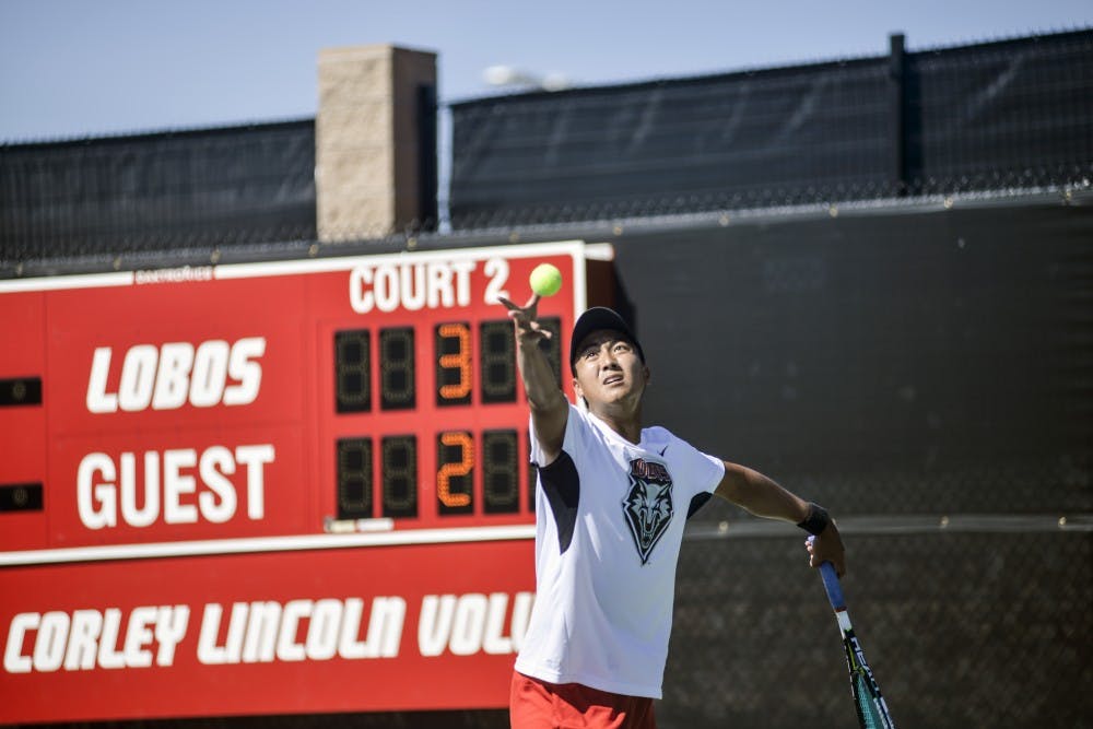 Lobos Augustus Ge sets up his serve during the Balloon Fiesta Invitational Oct. 9. The invitational was held at the McKinnon Family Tennis Center and lasted three days with singles and doubles matches.