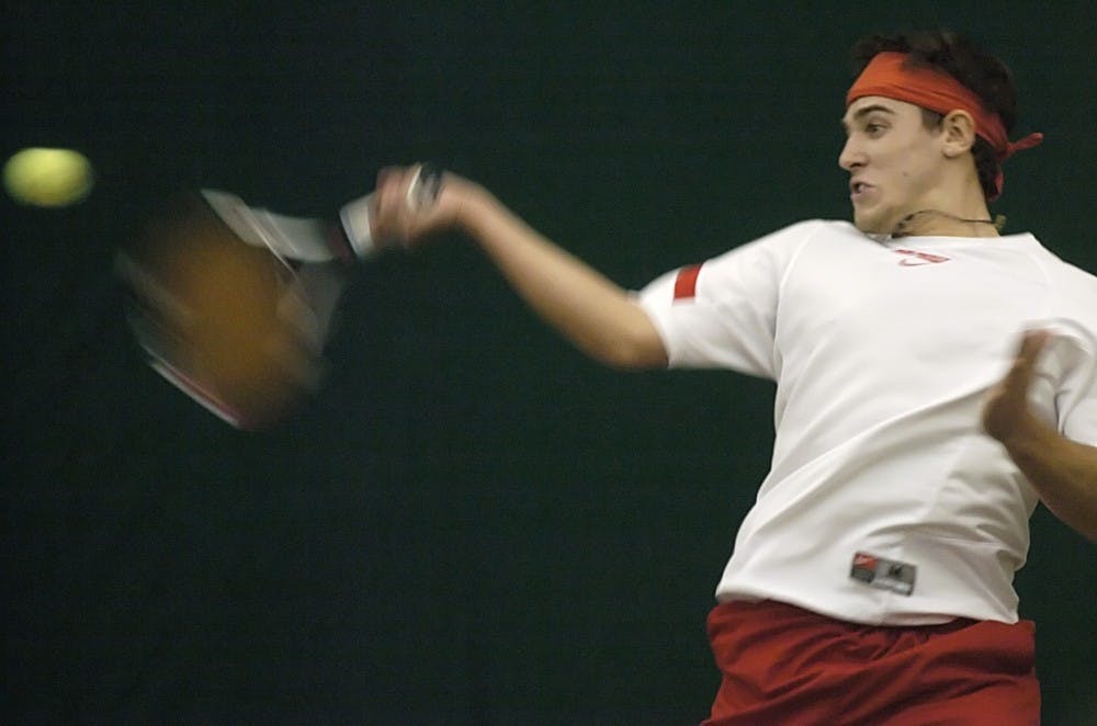 Johnny Parkes hits a forehand during Friday's 4-3 loss against Boise State at the UNM Tennis Complex. The Lobos fell to 1-2 after their second straight loss to Boise State.