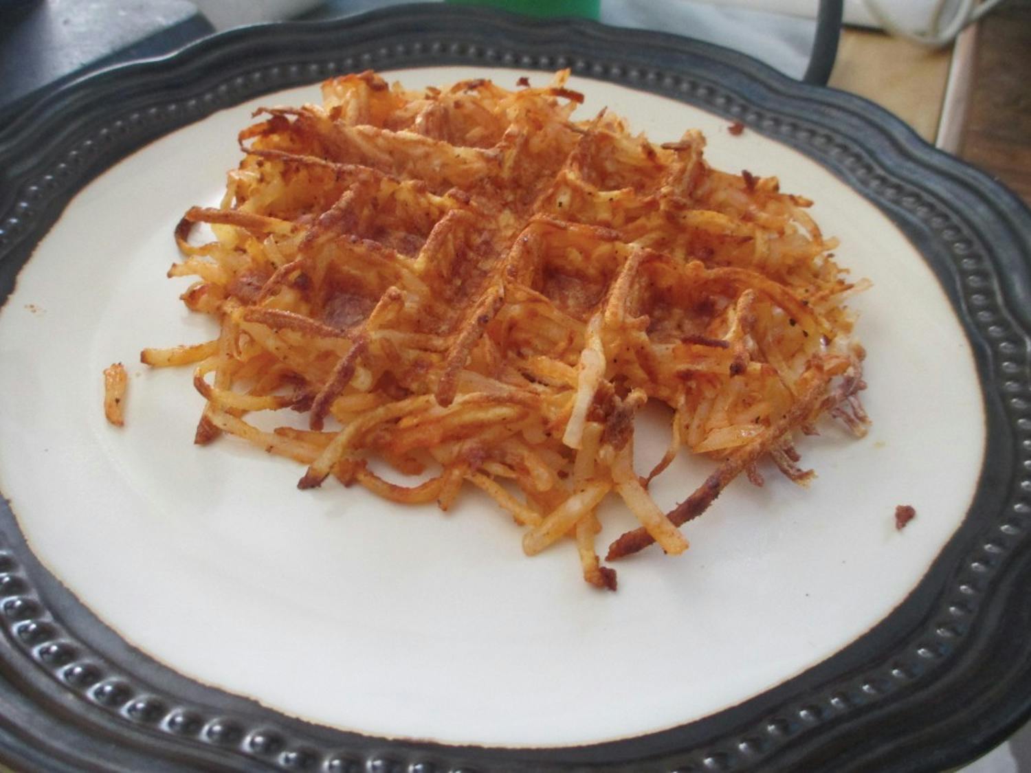 Hash browns cooked in a Belgian waffle iron come out crispy and golden. 