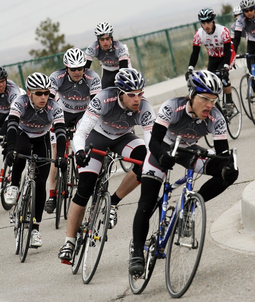 	The men’s cycling team takes a corner during their criterium event at Mesa Del Sol on Sunday. The club team is trying to increase its membership after a steep drop in membership in past years. 