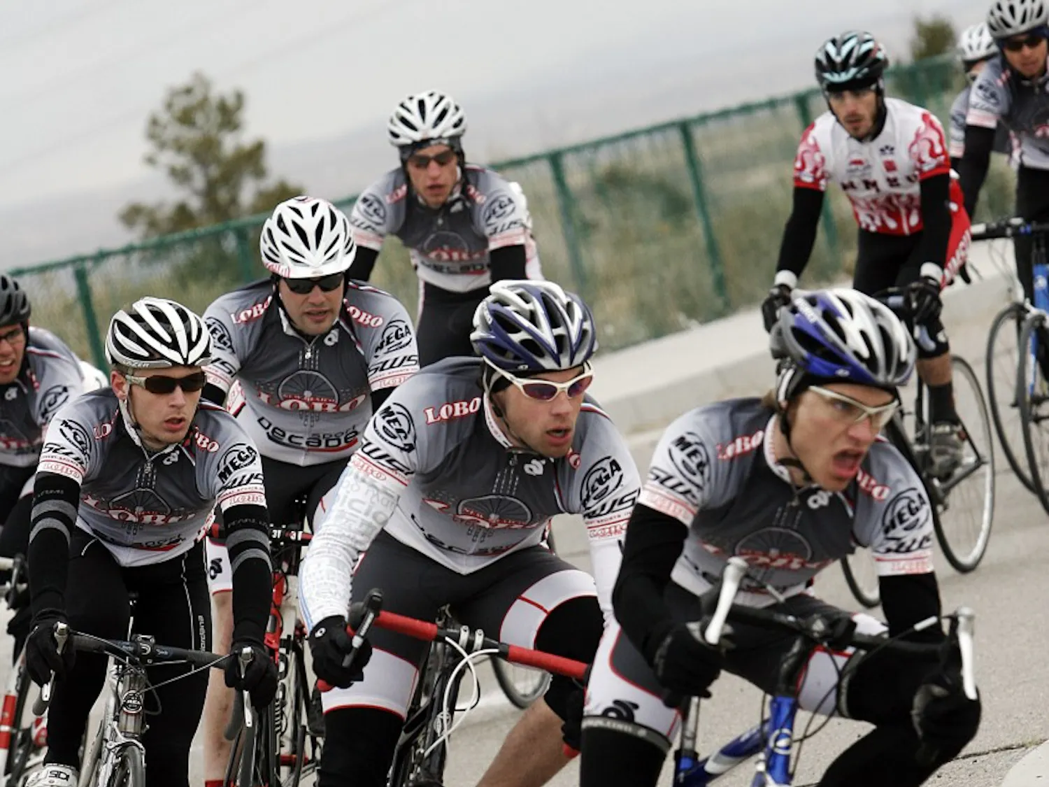 The men’s cycling team takes a corner during their criterium event at Mesa Del Sol on Sunday. The club team is trying to increase its membership after a steep drop in membership in past years.