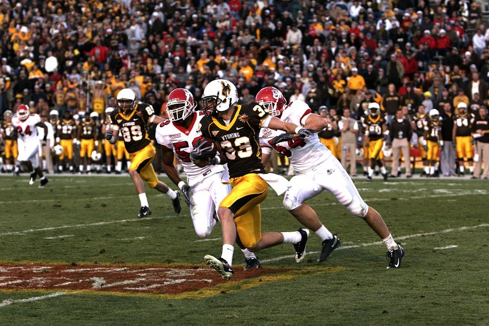 	Wyoming wide receiver David Leonard sprints during a play at the New Mexico Bowl at University Stadium on Saturday.