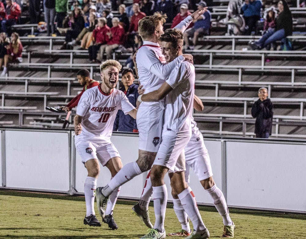 Matthew Constant hoists Luke Lawrence in the air after a header goal by Constant gave the Lobos the lead in the 37th minute in the Saturday, Oct. 7, 2017 matchup against Florida Atlantic University. 