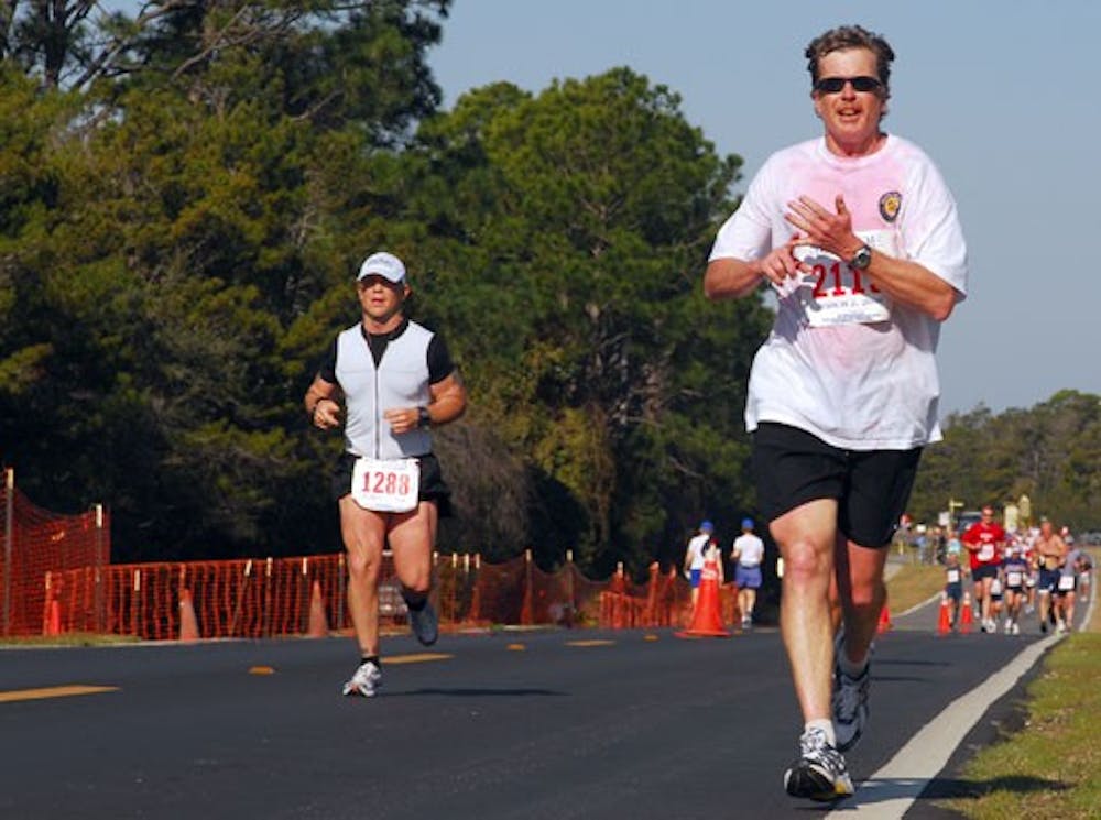 UNM sports physician Chris McGrew runs during the Grayton Beach Seaside Half Marathon on March 1. McGrew ran with no preparation and placed sixth for his age group.