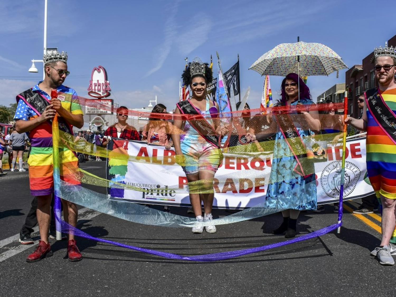 The Pride Parade began on June 8 at 10 A.M. Parade floats started at the intersection of Central and Girard and ended at the Expo New Mexico off Central and San Pedro, pictured are 2018 Pride New Mexico Title Holders, center Cece Knight Jones (left) and Felicia Roxx Starr Faraday (right).