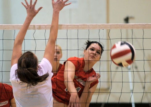 Middle blocker Anna Lehne spikes the ball during the Lobos' 2-1 win over the University of Denver during the UNM Spring Volleyball Tournament on Saturday. The Lobos went 5-0 at the invite.