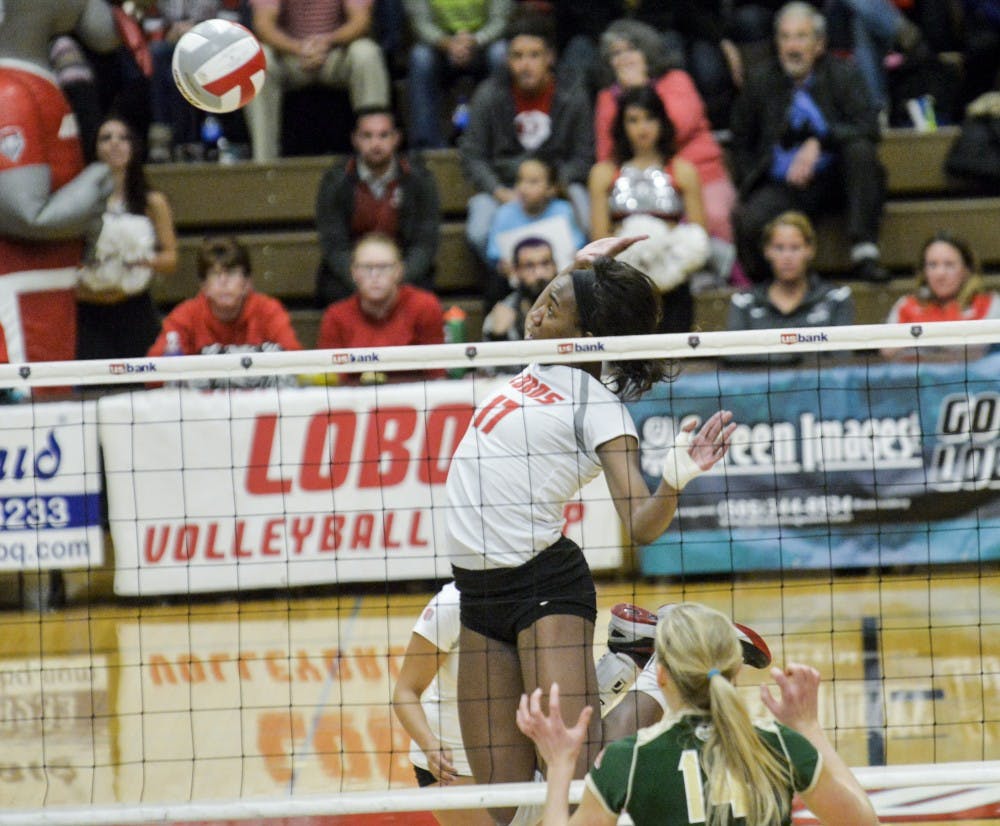 Senior middle blocker Skye Gullatt leaps up for a kill against CSU at Johnson Center Nov. 7. Gullatt received&nbsp;Mountain West Defensive Player of the Week for her performance against Air Force.&nbsp;