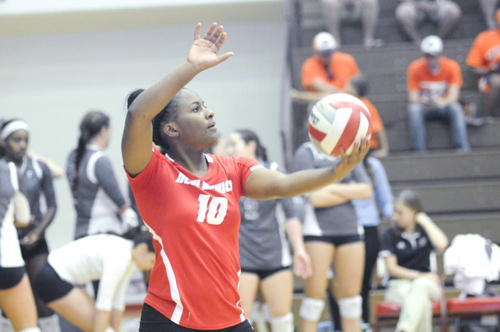 	New Mexico volleyball defensive specialist Taylor Cross prepare to serve the ball during a match last Saturday. The Lobos faced off against Hawaii late Thursday night to jump start the Hawaiian Airlines Wahine Volleyball Classic at the Stan Sheriff Center. 