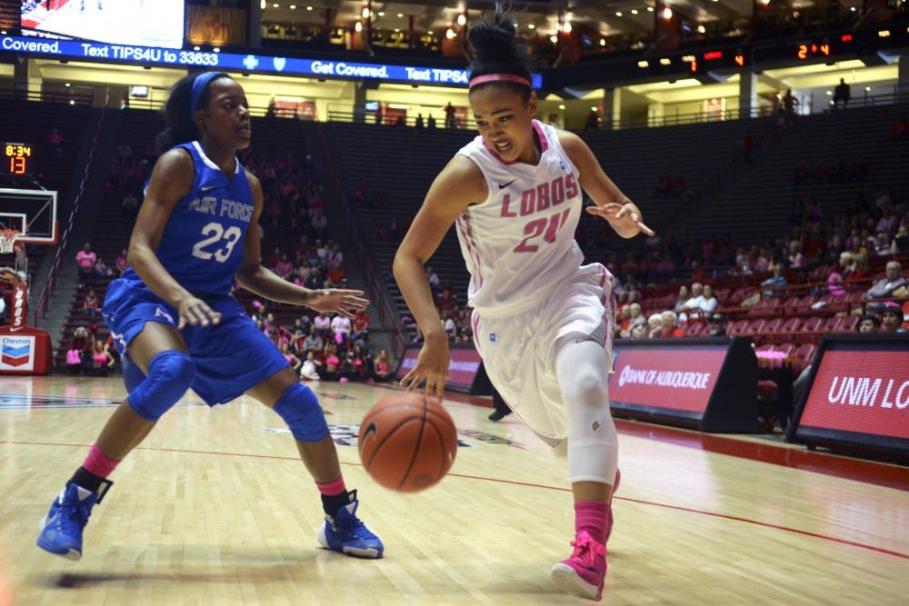 Jayda Bovero maneuvers her way around Dee Bennett Saturday afternoon at WisePies Arena. The Lobos routed the Falcons 58-36 and moved to 14-11 on the season with the victory. 