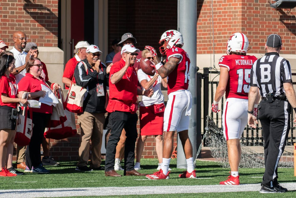 Sophomore receiver Reggie Virgil shared an embrace with Miami University President Gregory Crawford after his first career touchdown on Saturday.