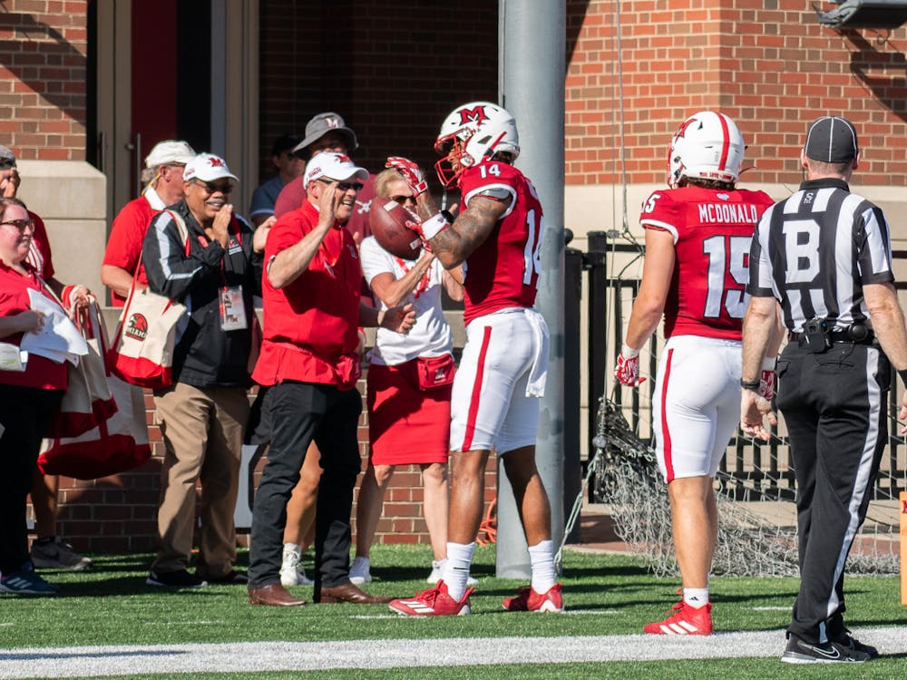 Sophomore receiver Reggie Virgil shared an embrace with Miami University President Gregory Crawford after his first career touchdown on Saturday.