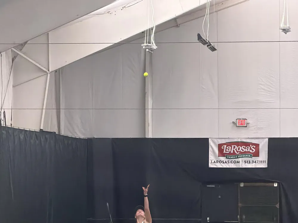 Freshman Allie Faulkner prepares to serve in a singles match