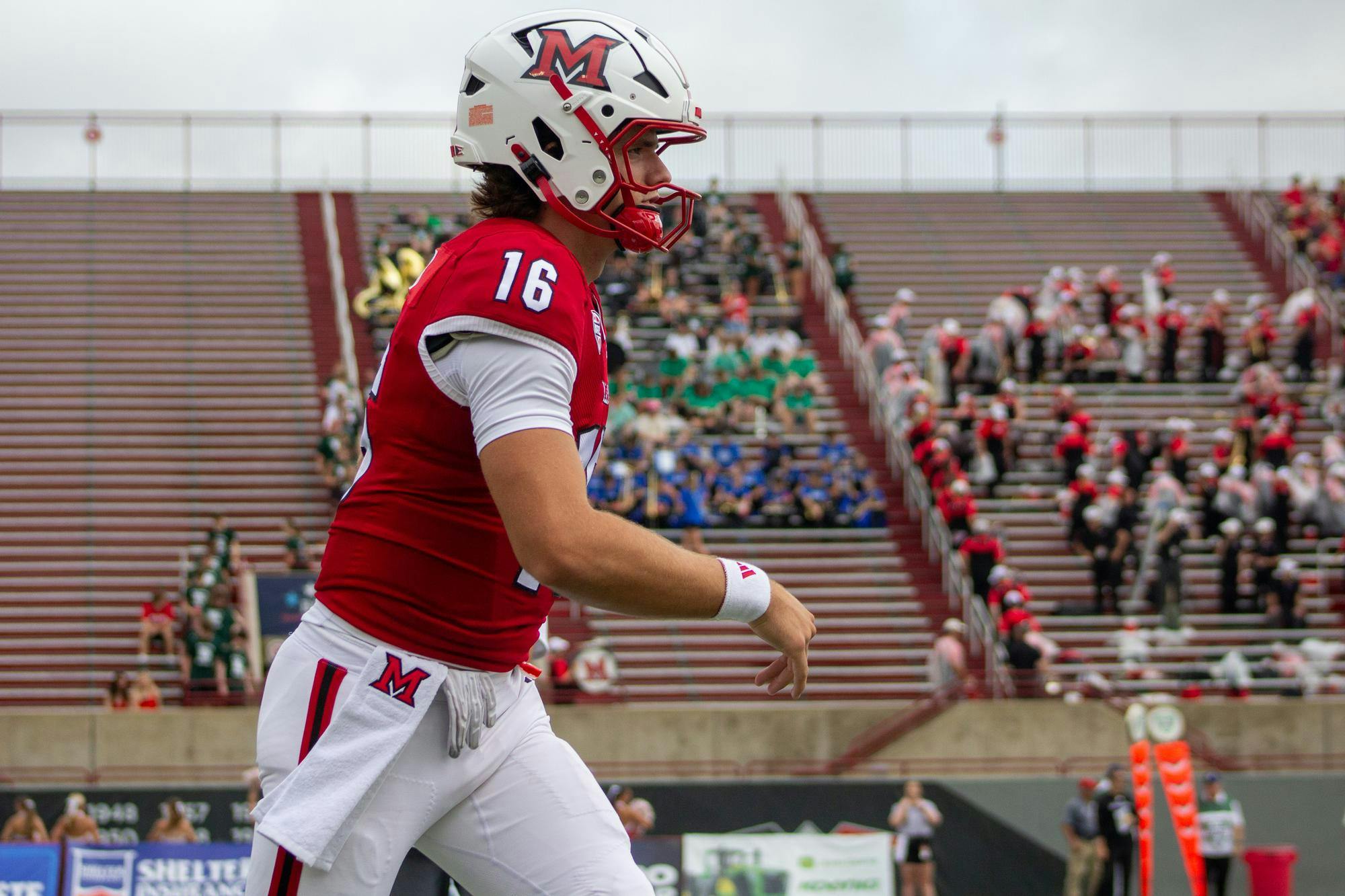 Quarterback David McComb warms up before the start of Miami vs Holy Cross on Sept. 12.