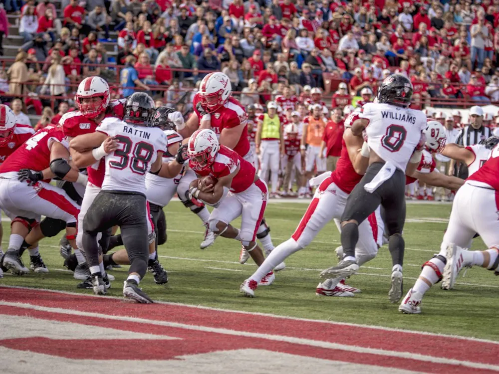 Junior running back Jaylon Bester carries the ball for Miami in a 27-24 RedHawks victory at Yager Stadium on Oct. 19. The Miami Student's Michael Vestey ranks Miami second in the MAC East and Northern Illinois last in the MAC West through this season's first seven games.