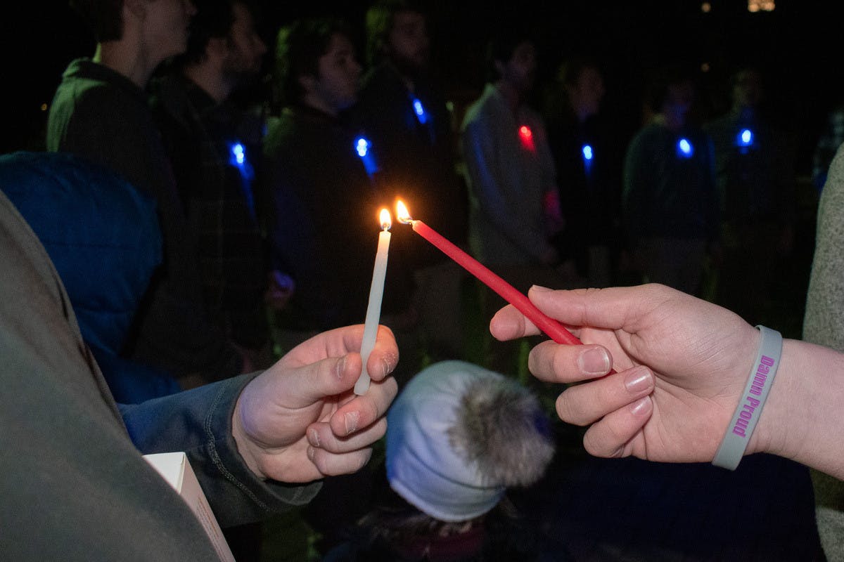 Students celebrate the first night of Hanukkah.
