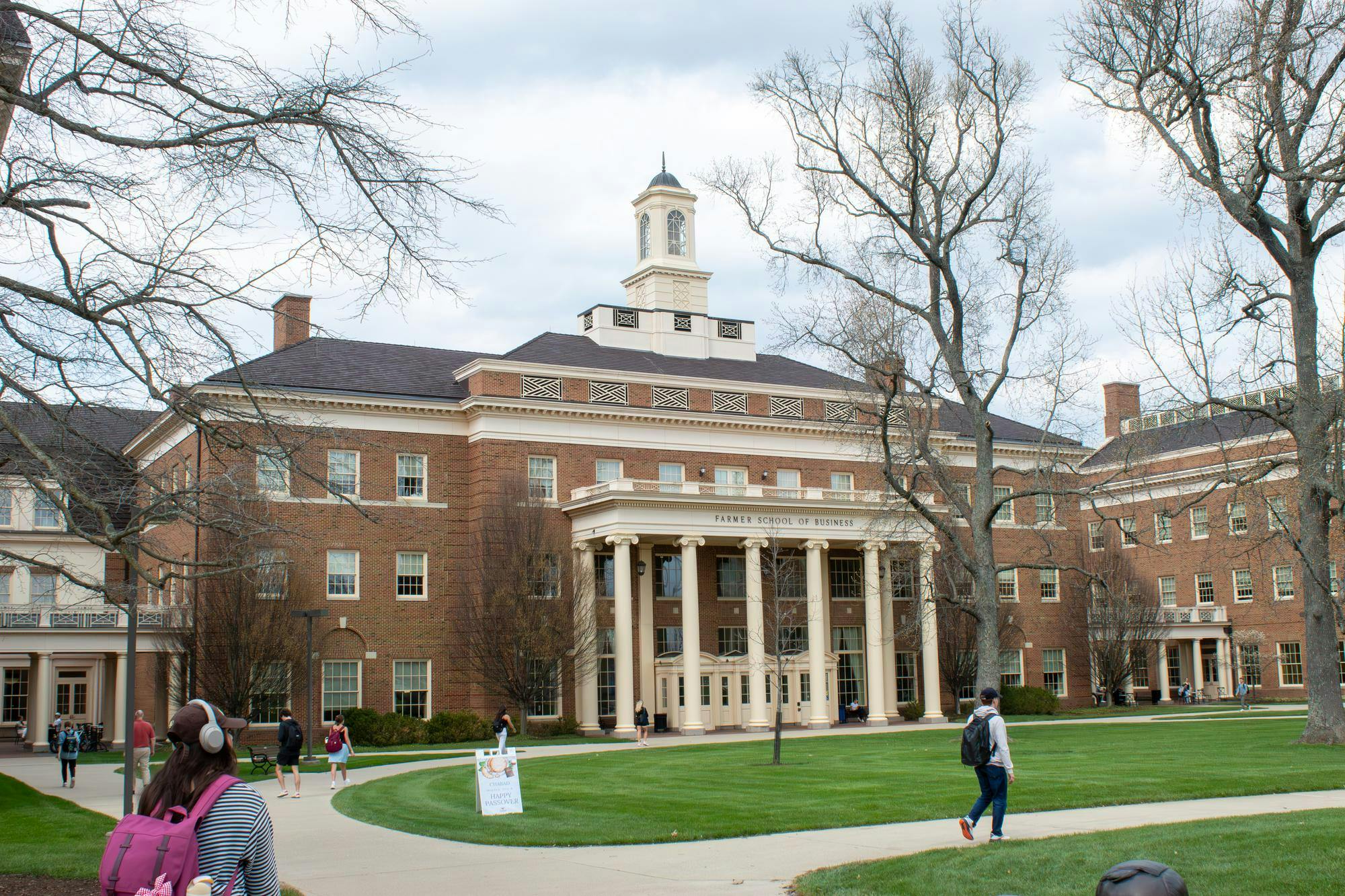 Students walk in front of Farmer School of Business.