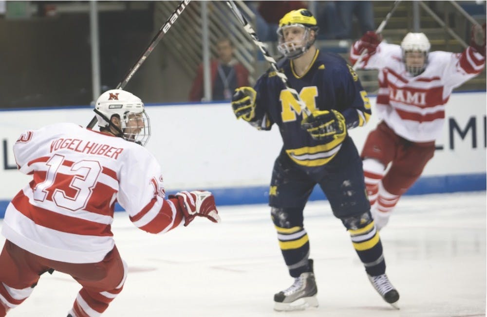 Trent Vogelhuber celebrates after beating Michigan 3-2 in double overtime in the NCAA Regional Final.