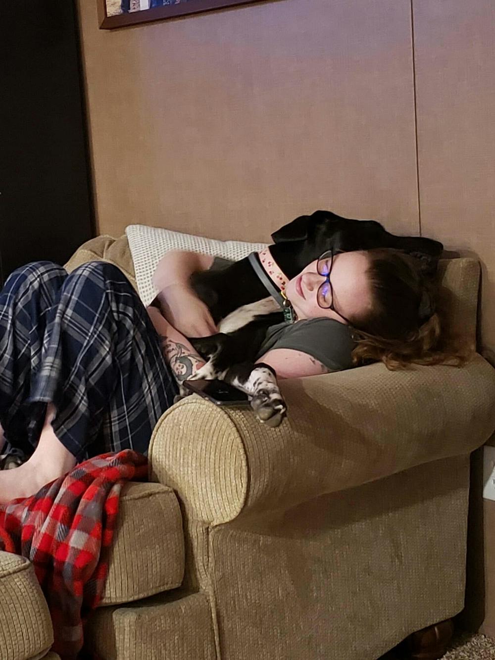 Staff writer Chloe Southard takes a nap with her beloved Great Dane, Lolita.