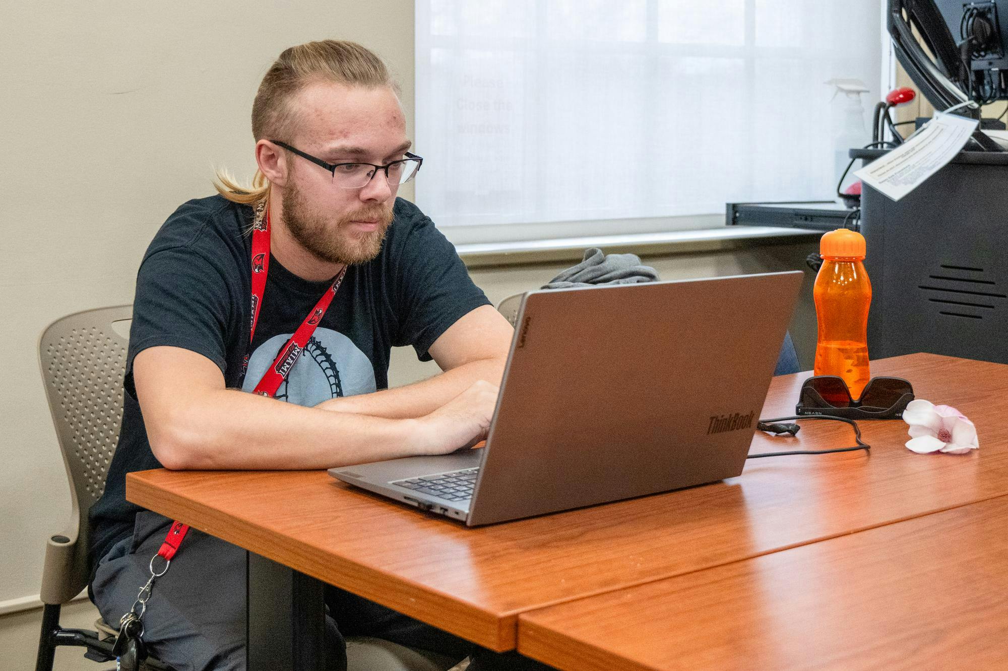 Michael Hollingsworth completes his coursework in Harrison Hall. 