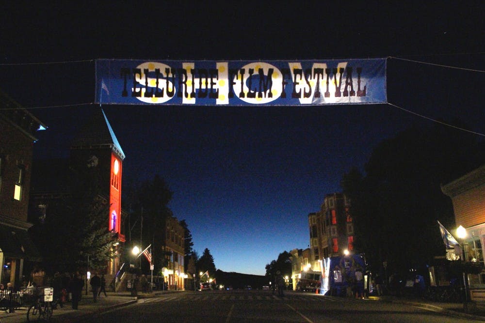 The festival banner hung above the main street at dusk. Theaters up and down the main stretch sometimes played from 8am to past midnight.