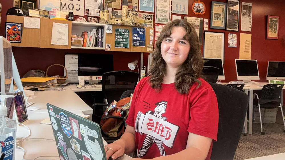 Shannon Mahoney sits at her desk in The Miami Student newsroom in Armstrong Student Center. Photo provided by Shannon Mahoney