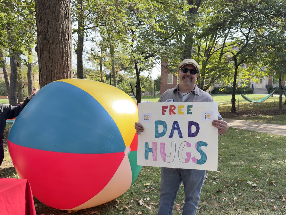 Mark Radlinski, a local teacher, came to an LGBTQ event at Miami to offer free hugs to students.