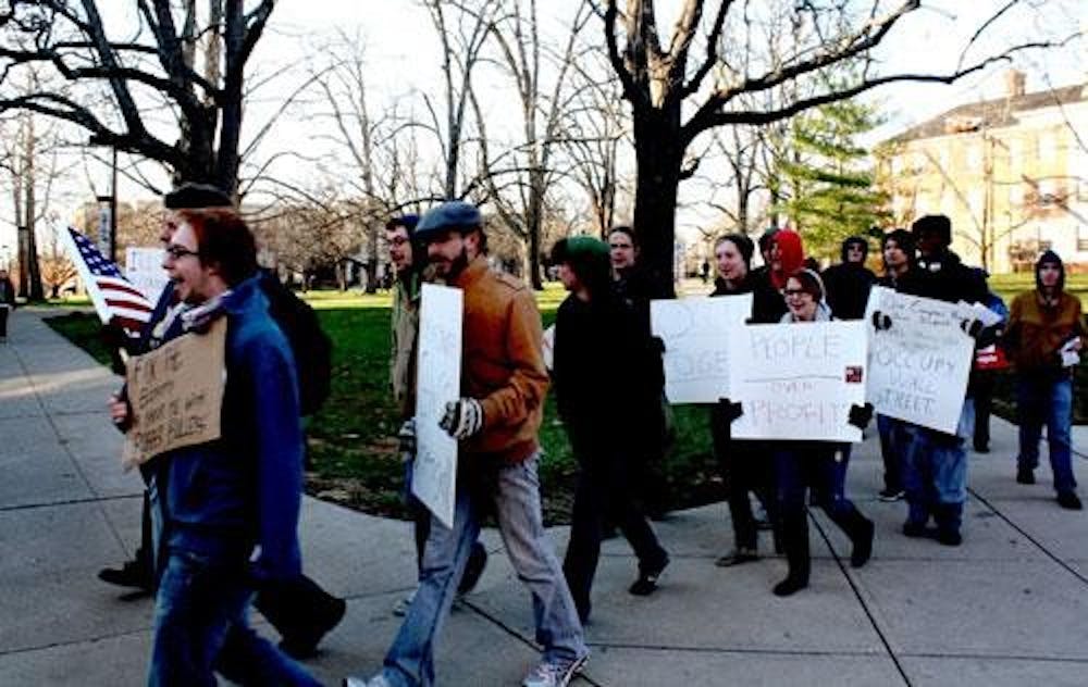 Protestors march through Oxford and Miami University’s campus in support of the nationwide “Occupy” movement Thursday afternoon. The protestors were demonstrating against high tuition and high unemployment, amongst other issues. 