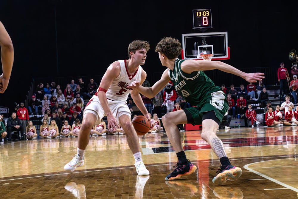 Peter Suder dribbling against Dillion Tingler in the first matchup between Miami and Eastern Michigan on Jan. 28 at Millett Hall 