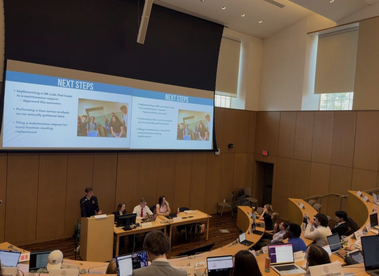 ASG Senators and cabinet view presentation on initiative's next steps.