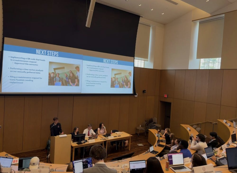 ASG Senators and cabinet view presentation on initiative's next steps.