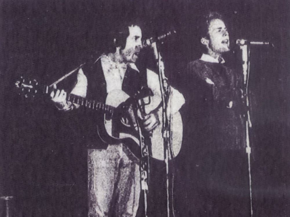 The largest crowd ever to gather in the Assembly Hall (over 11,000) witnessed the old and the new sounds of the popular Simon and Garfunkel guitar-vocal duo. Not shown in the picture is Paul Simon’s brother who appeared briefly on the stage in their “Hello, Love” which reminded many of the Everly Brothers