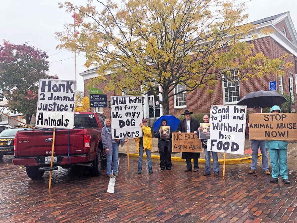 Passing cars honked in response to animal rights protestors outside the Oxford Courthouse.