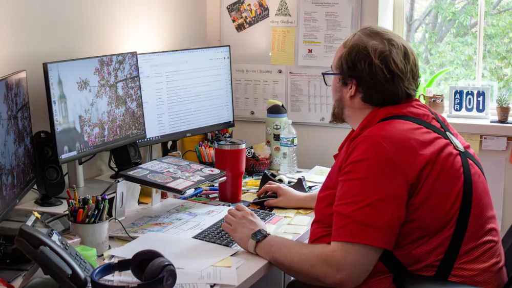Armstrong Operations Manager Blake Nash works at his desk at 3015 Armstrong.