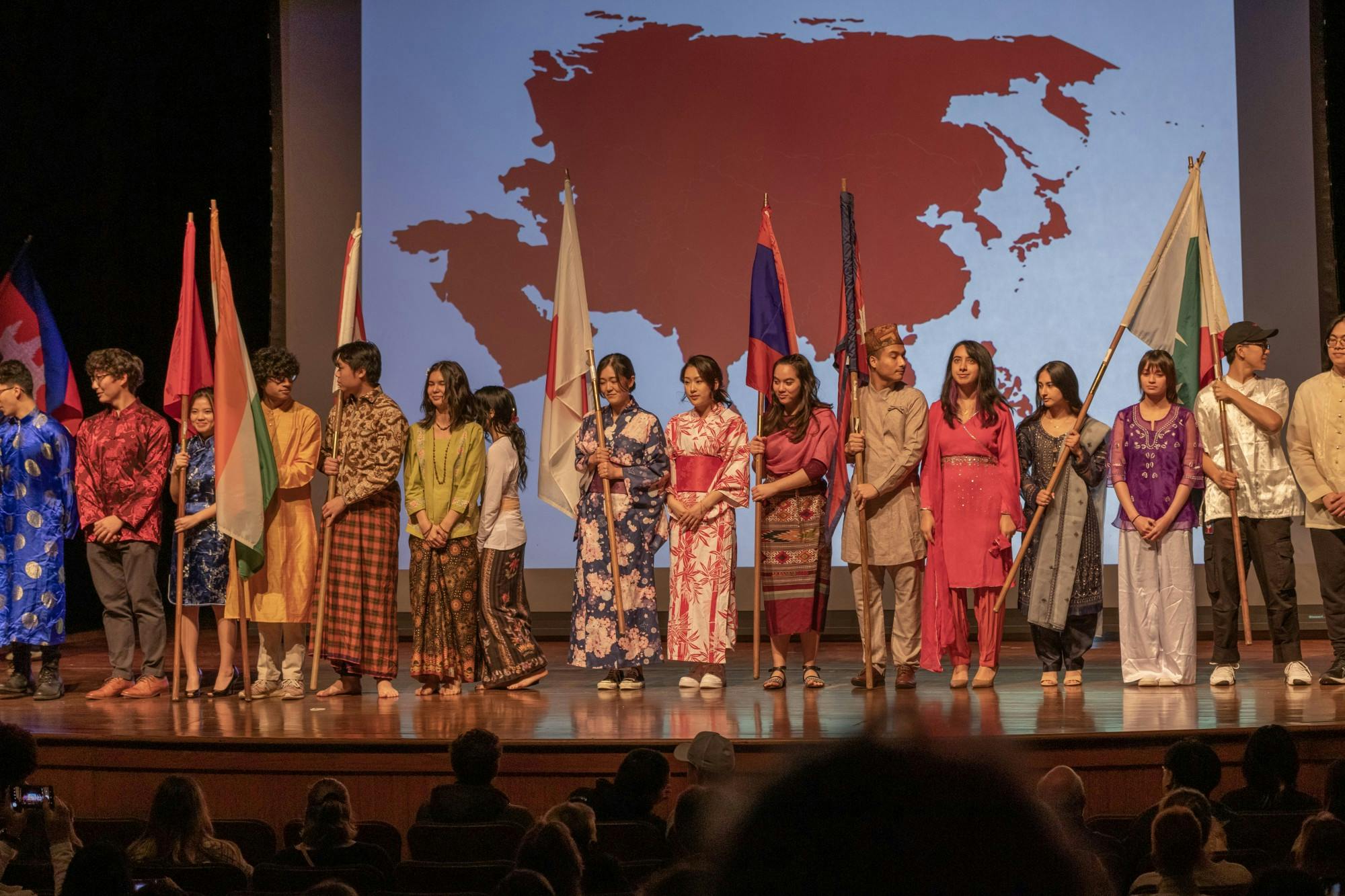 The performance opened with a flag ceremony. More than 20 students marched dressed in the traditional garb of a country and bearing its flag.