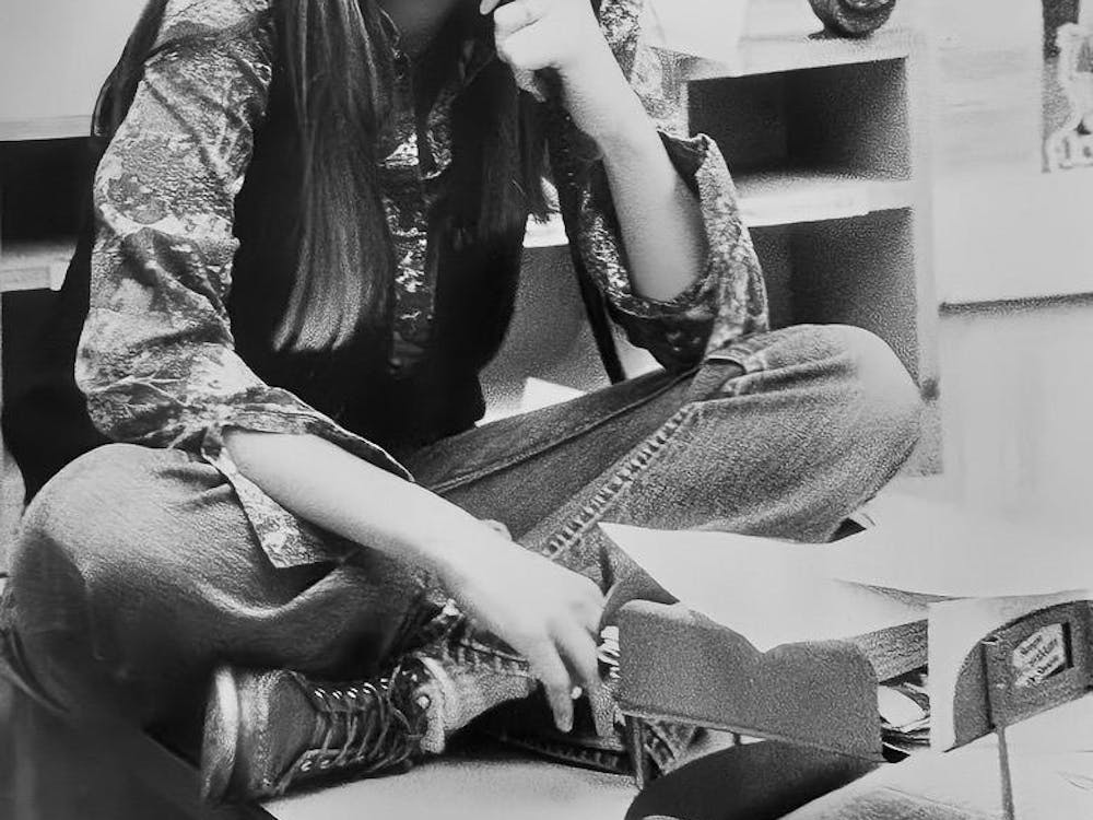 Sue MacDonald answers the phone in The Miami Student newsroom