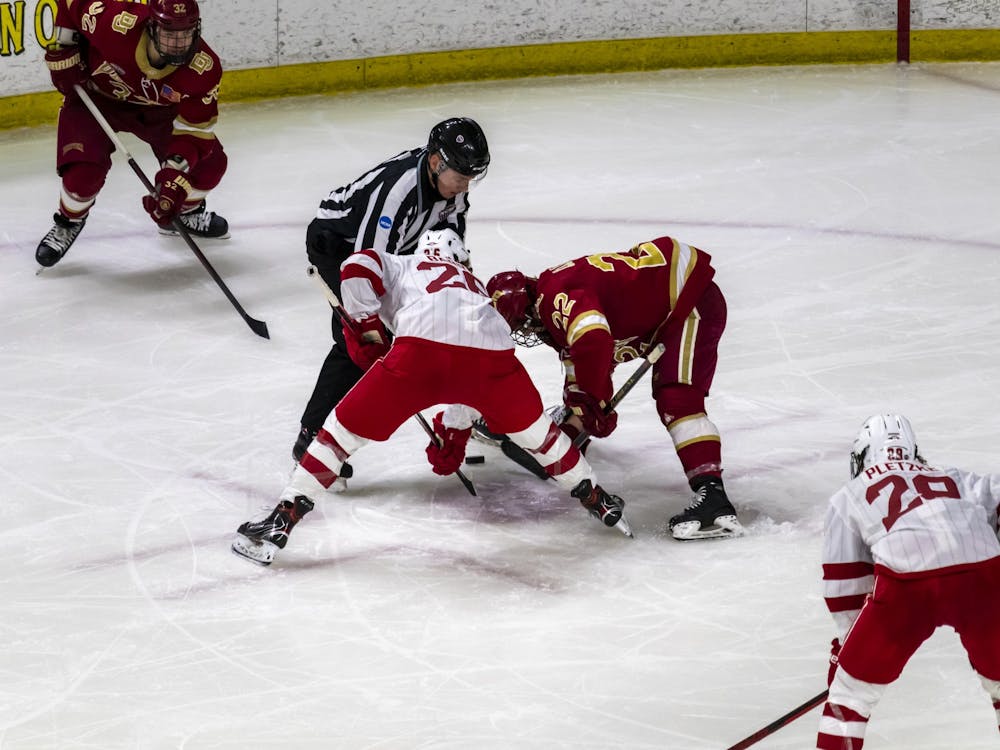 Senior forward Matt Barry faces off against Denver forward Connor Caponi in a weekend series against the Pioneers.