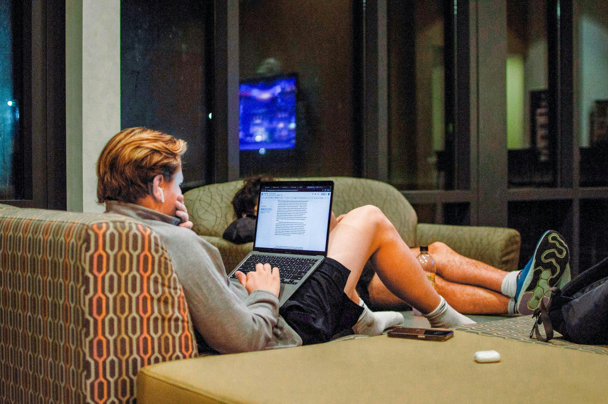A student works on class assignments in Hillcrest Hall. 