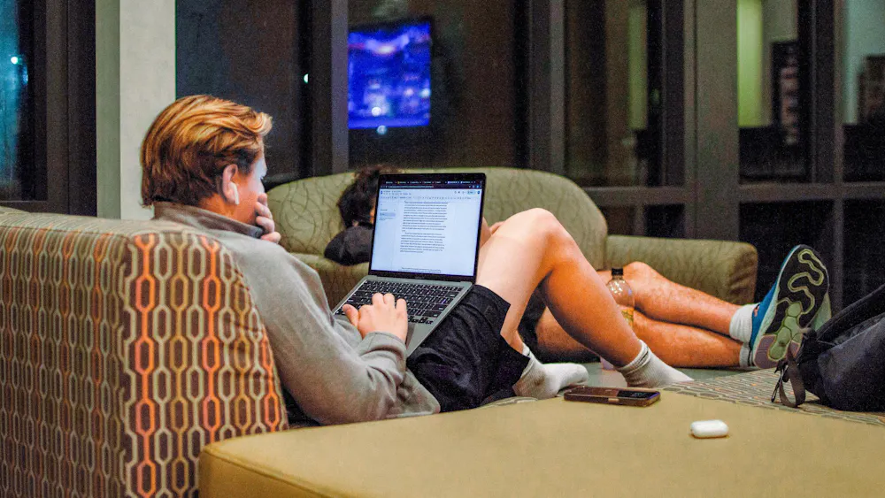 A student works on class assignments in Hillcrest Hall.